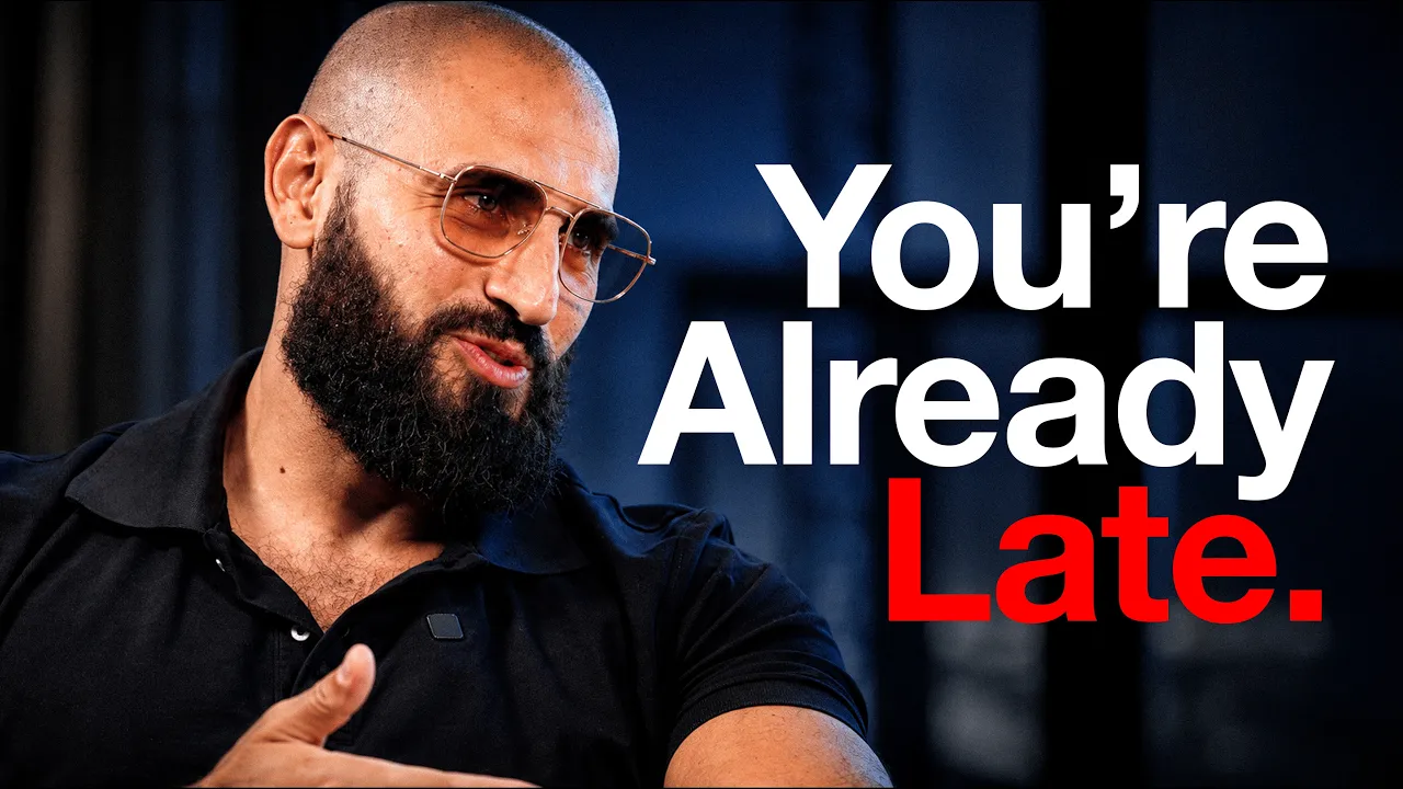 Bald bearded man in tinted glasses gesturing beside the words You're Already Late