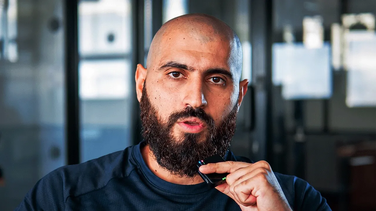 Leon Abboud speaking into a small microphone in a bright office
